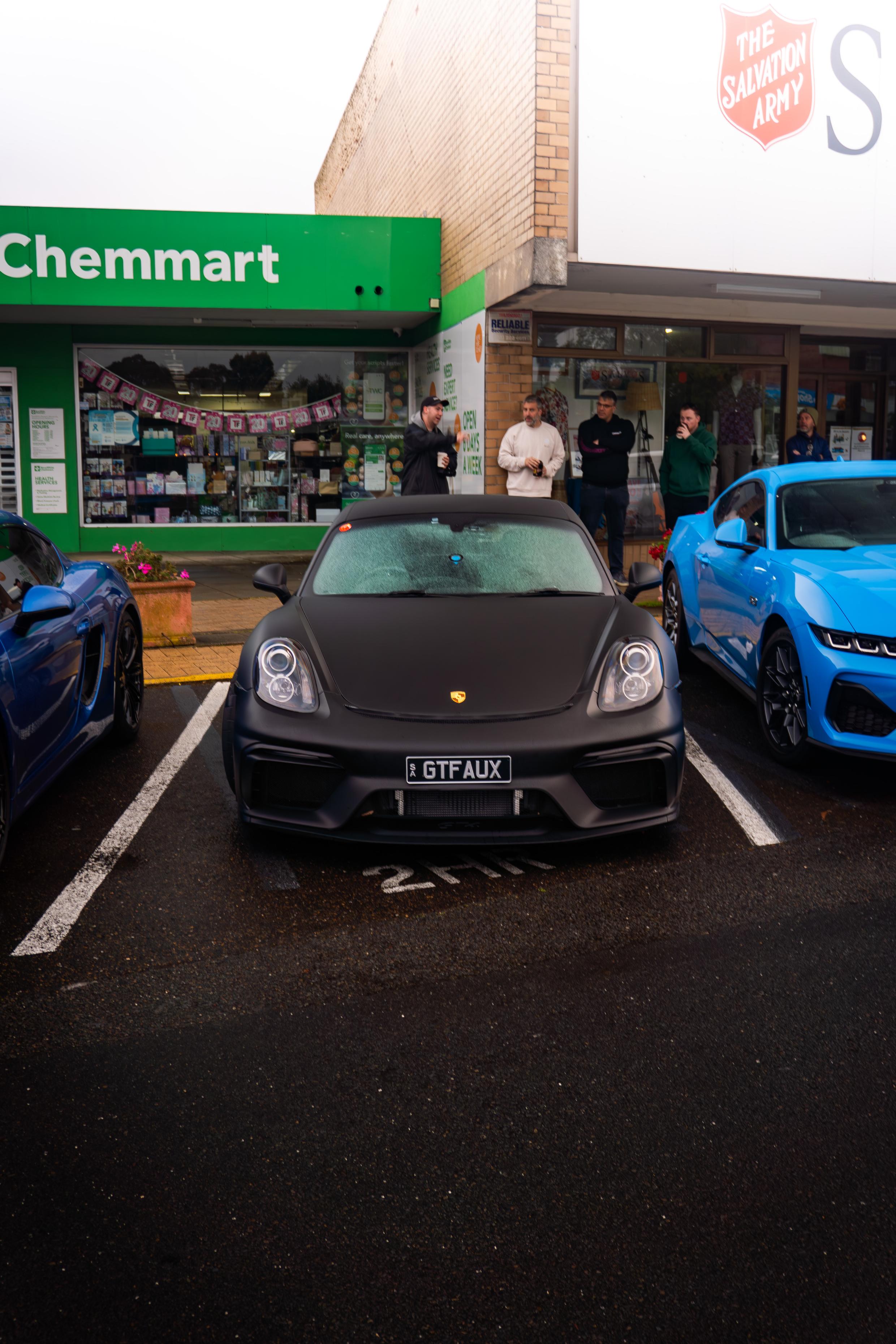 Front view of a black Porsche at Blackwood Cars & Coffee
